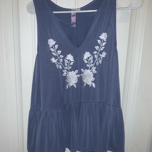 Light blue flowy top with white flower details